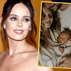 Olga Kalicka z dzieckiem w ramionach, uśmiechnięta, czule tulona przez partnera. Rodzinne szczęście.