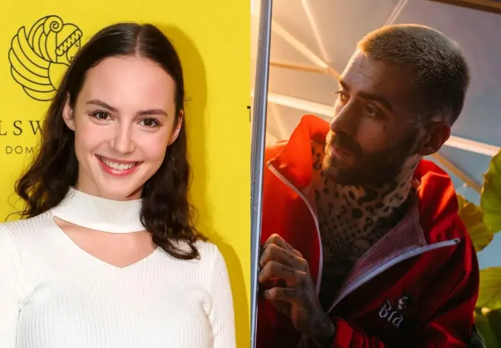 Martyna Byczkowska uśmiecha się na tle żółtej ściany, obok Quebo w czerwonej kurtce.