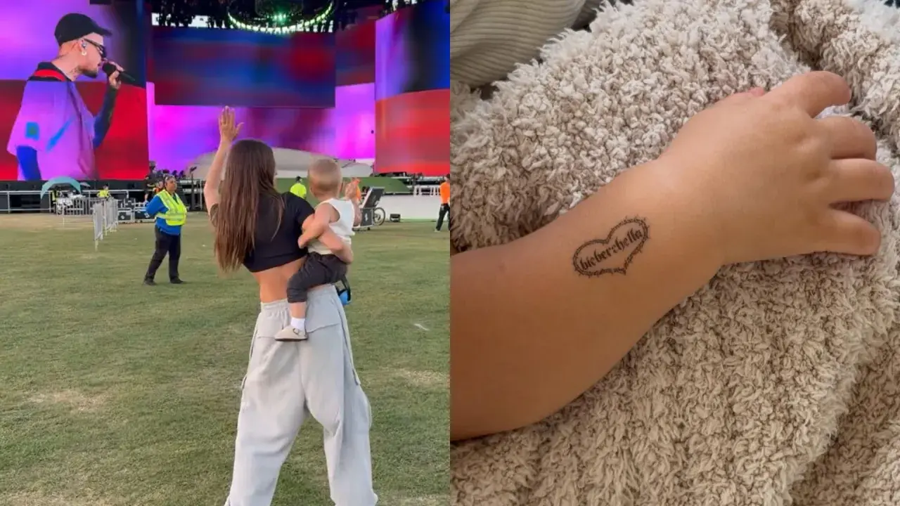 Dziecko z tatuażem "Bieberchella" na ręce, obok kobieta z dzieckiem na koncercie.