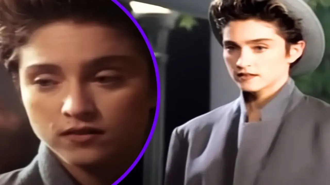 Młoda kobieta w szarym płaszczu i kapeluszu, jak z filmu "La Isla Bonita", zamyślona.