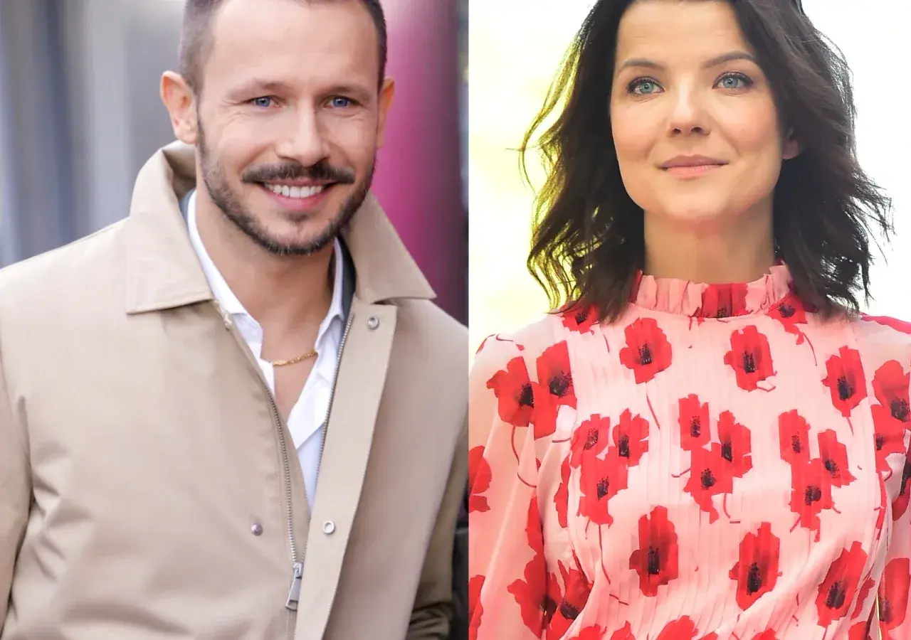 Joanna Jabłczyńska i jej mąż Piotr uśmiechają się do obiektywu. Ona w kwiecistej sukience, on w beżowej kurtce.