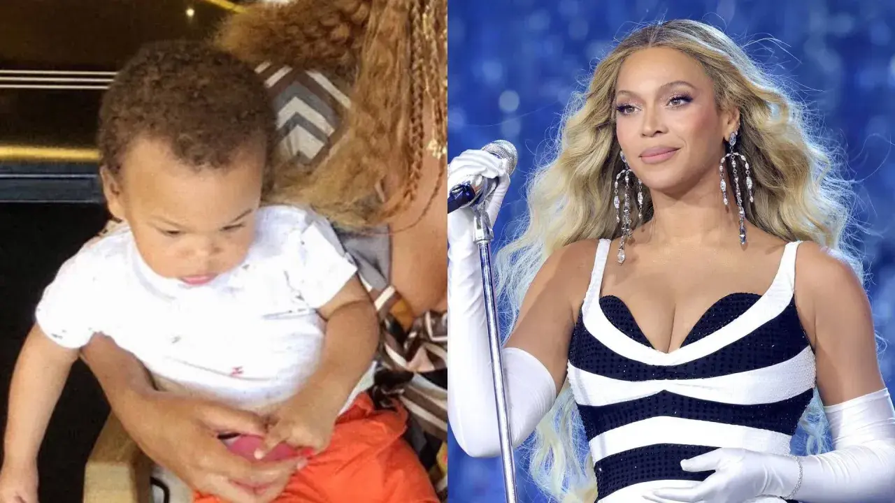 Mały sir Carter w białej koszulce i pomarańczowych spodenkach, obok Beyoncé w błyszczącej sukience.